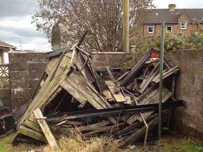 Collapsed garden shed for removal