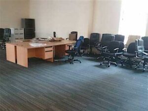 Desks and chairs in office space