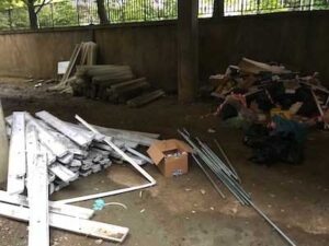 Lighting and debris in a shopping centre car park before removal
